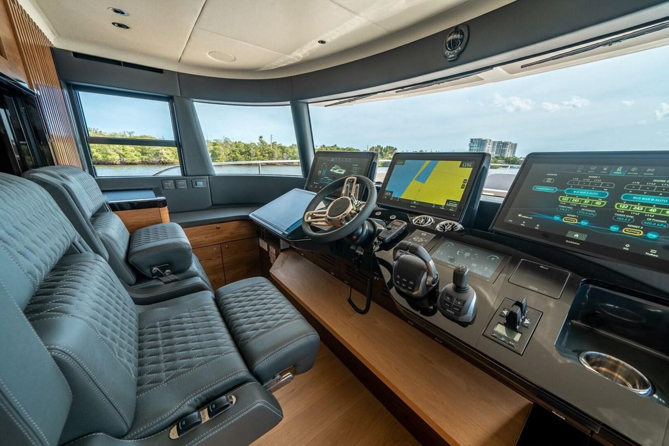 a car with a desk and a couple of monitors aboard NAVETTA 68 Yacht for Sale