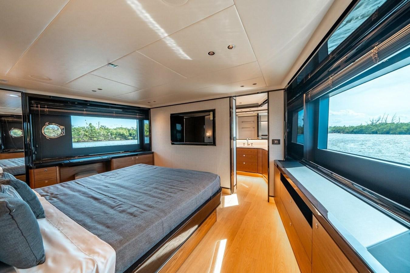 a bedroom with a large bed aboard NAVETTA 68 Yacht for Sale