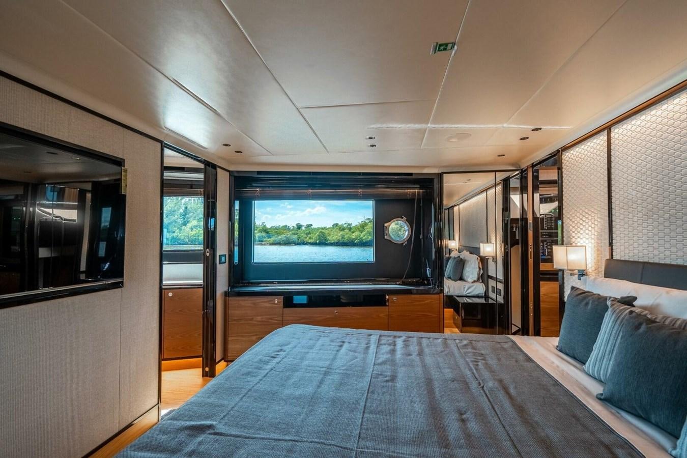 a bed in a room aboard NAVETTA 68 Yacht for Sale