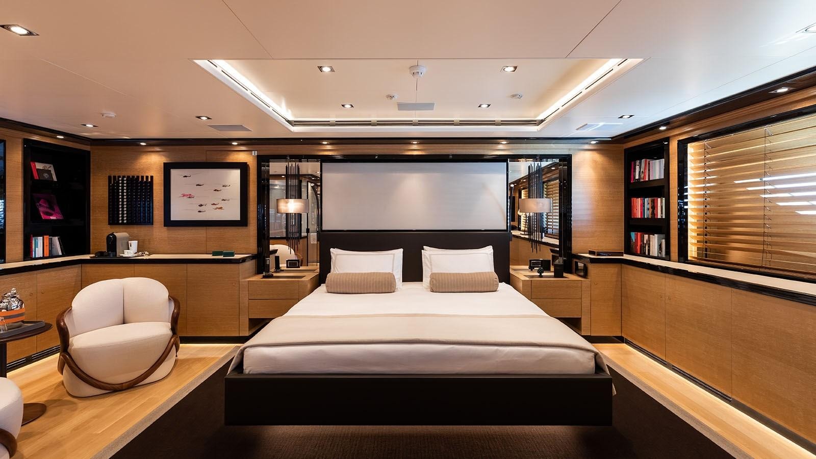 a room with a bed and a book shelf aboard ALASKA Yacht for Sale