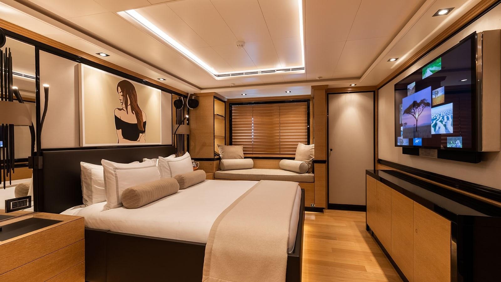 a hotel room with a bed and a tv aboard ALASKA Yacht for Sale