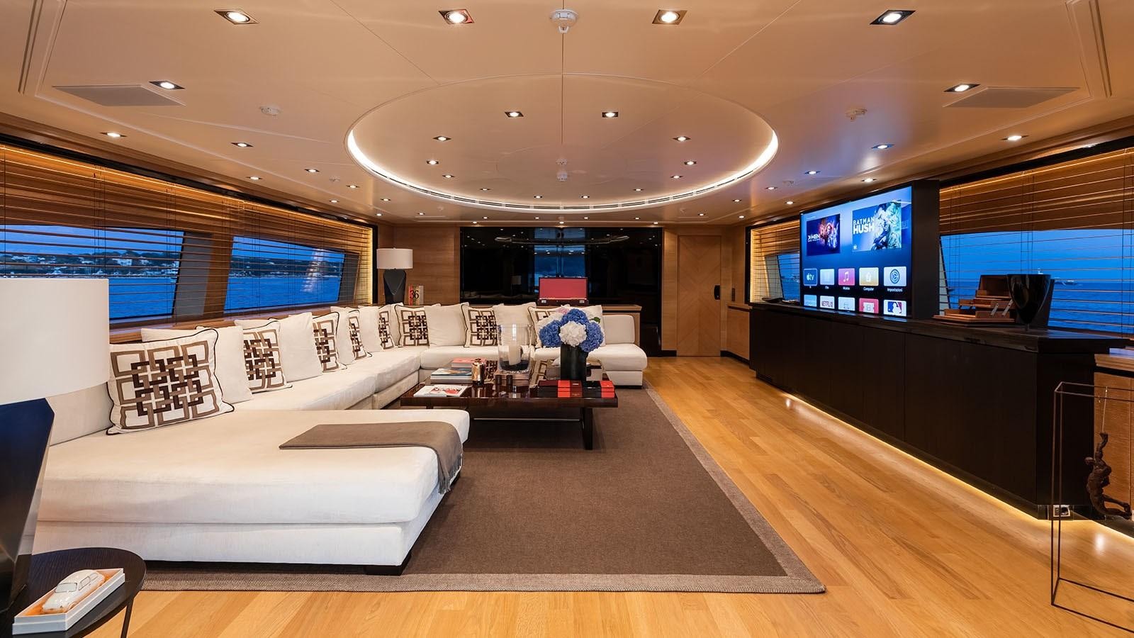 a large living room with a large screen aboard ALASKA Yacht for Sale