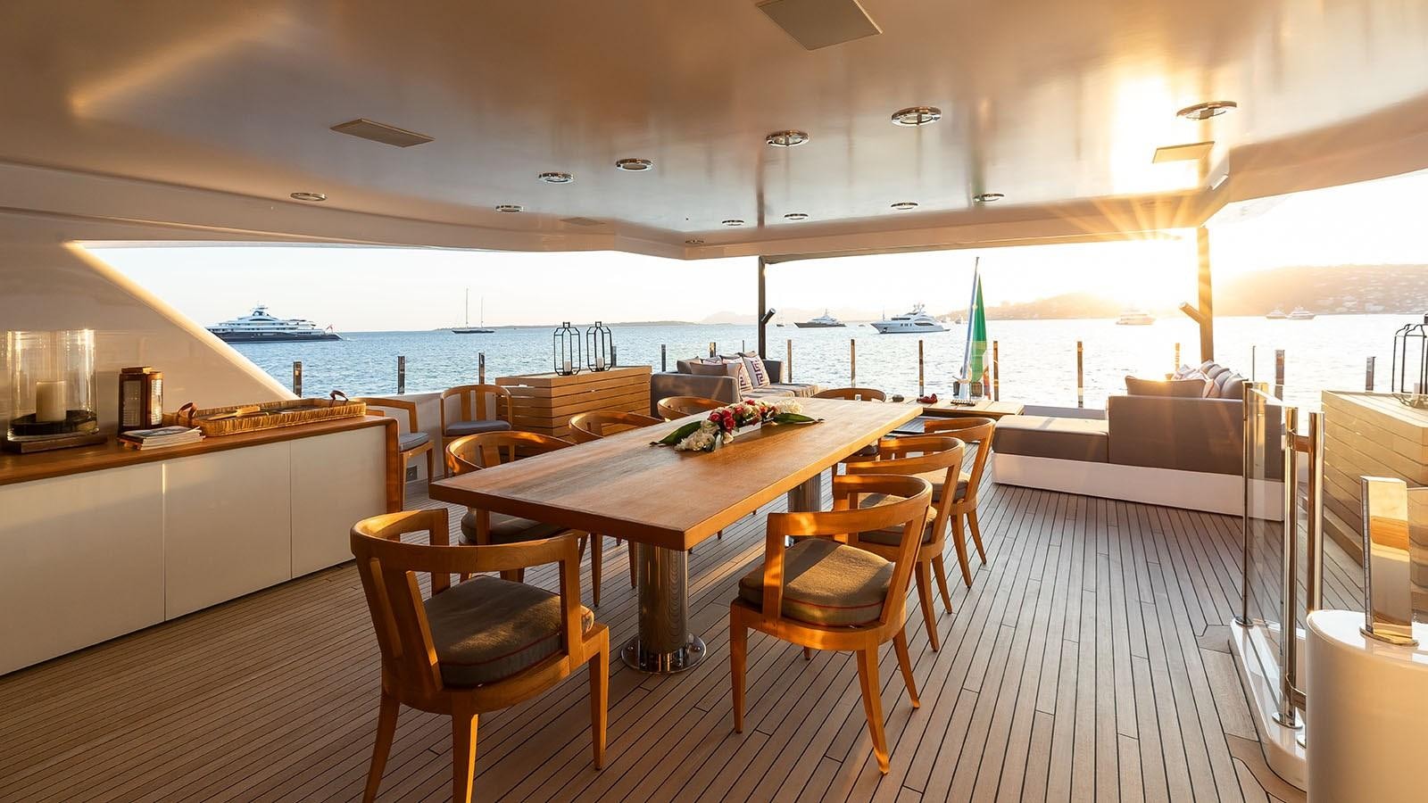a room with a table and chairs aboard ALASKA Yacht for Sale