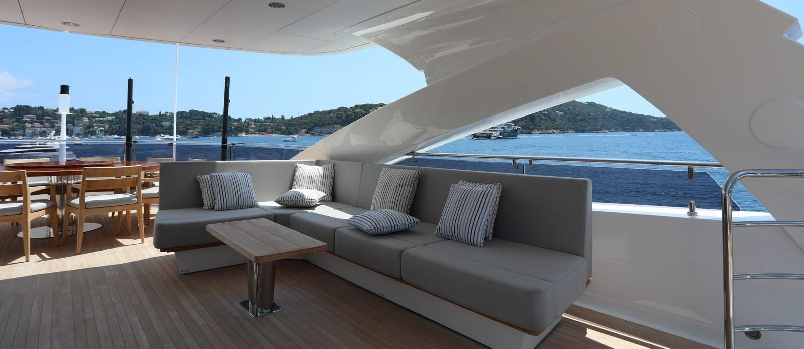 a couch and a table on a boat aboard ALADDIN Yacht for Sale