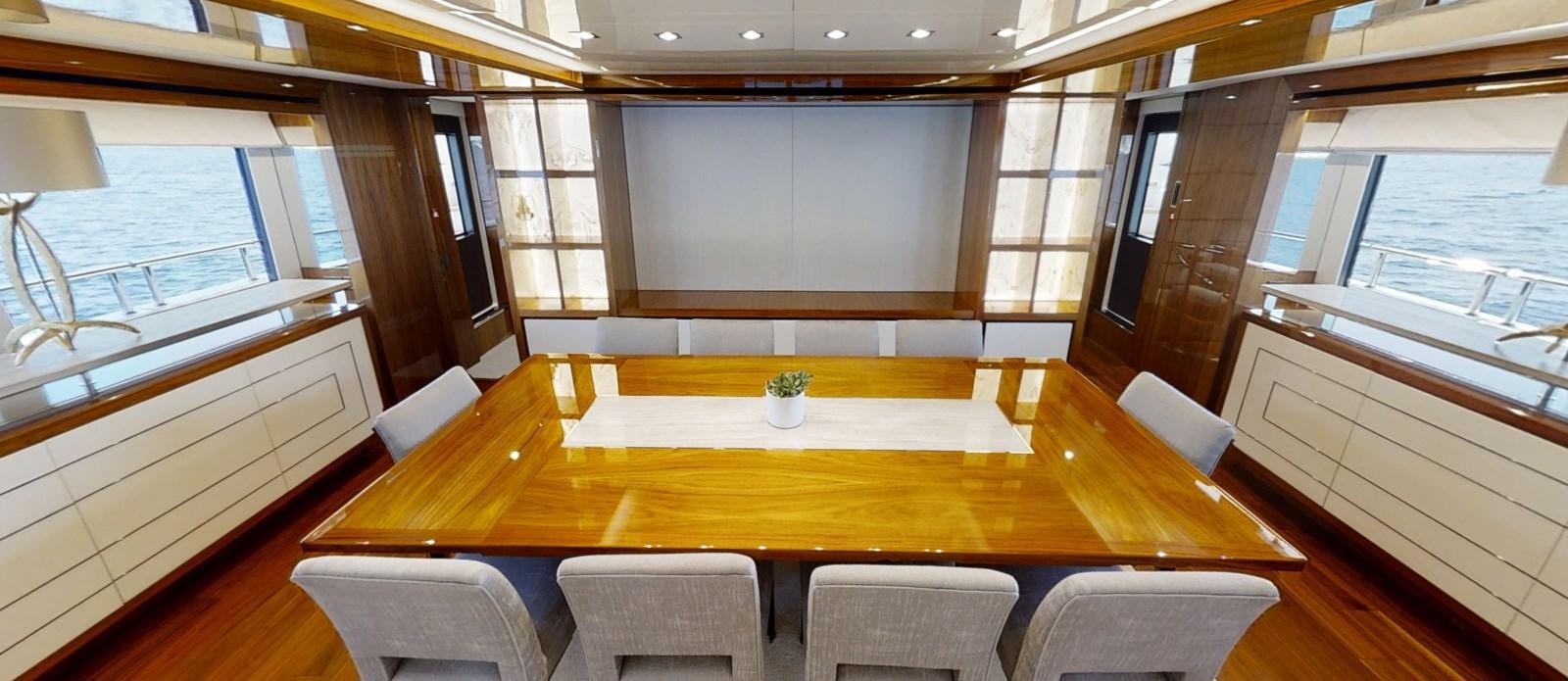 a room with a table and chairs aboard ALADDIN Yacht for Sale
