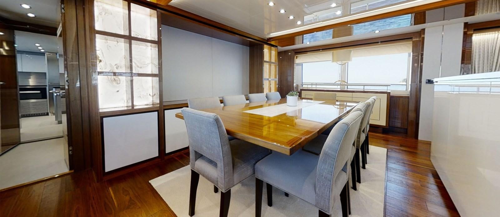 a room with a table and chairs aboard ALADDIN Yacht for Sale