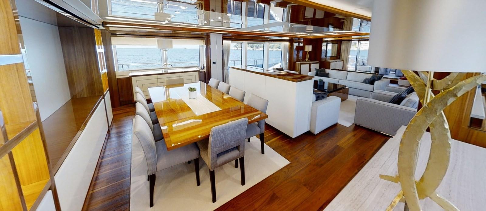 a room with a table and chairs aboard ALADDIN Yacht for Sale