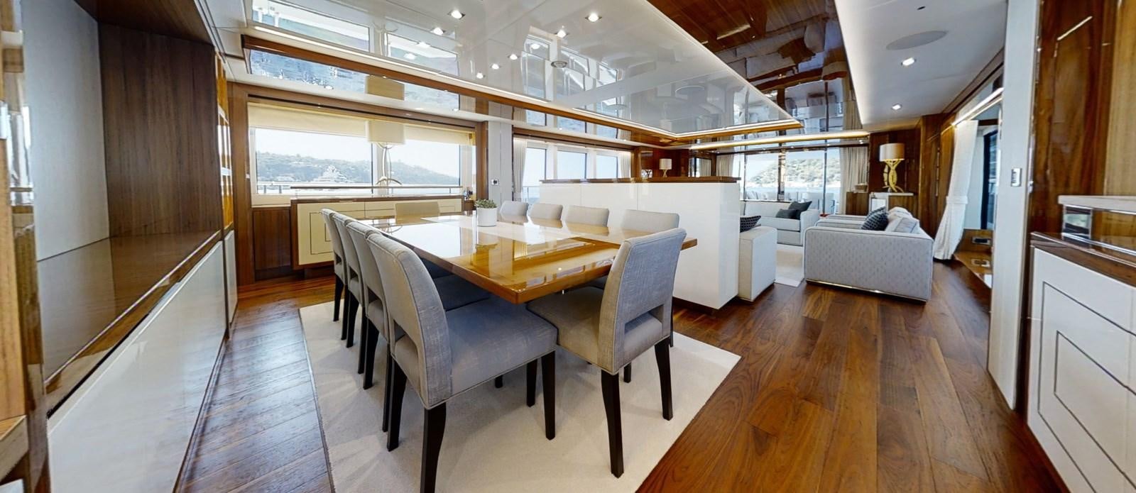 a large room with a table and chairs aboard ALADDIN Yacht for Sale