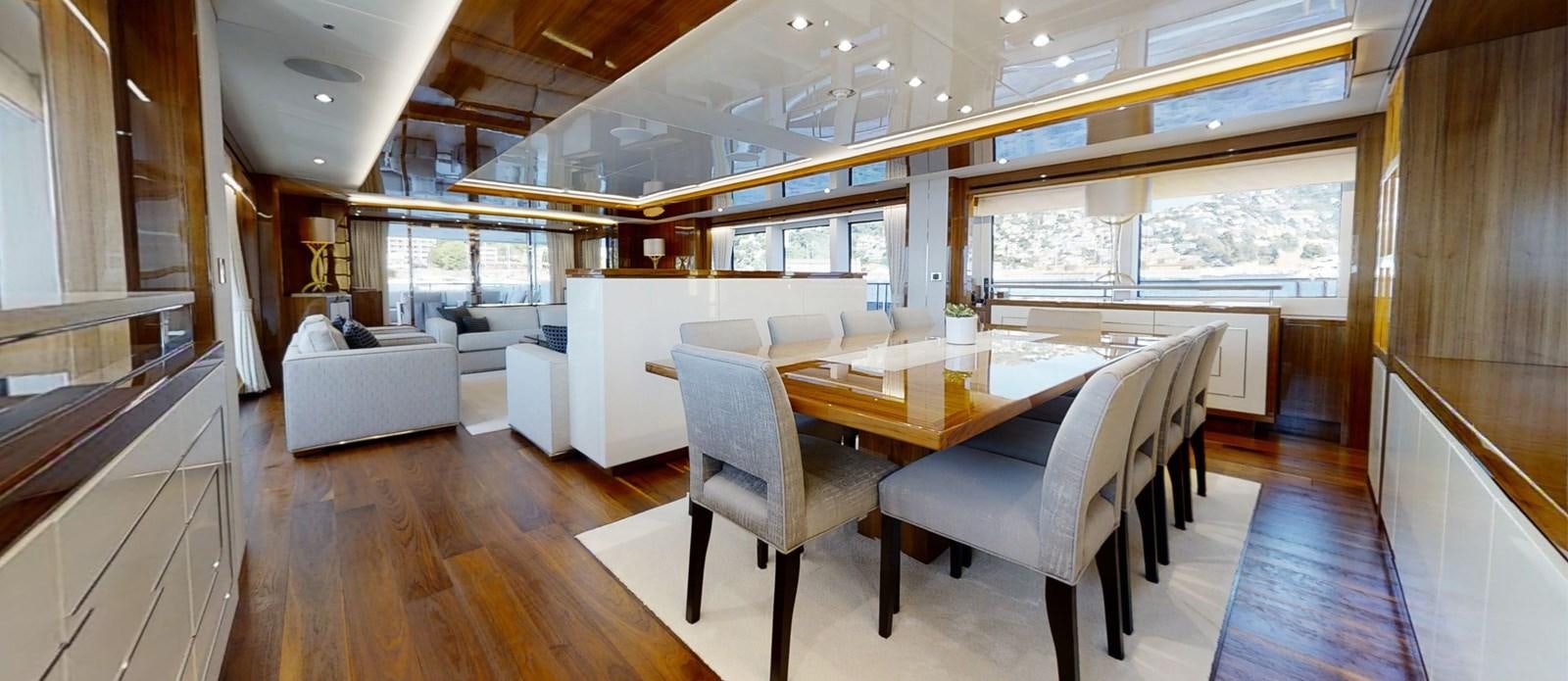 a large room with a table and chairs aboard ALADDIN Yacht for Sale