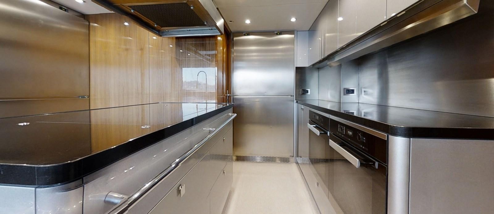 a large kitchen with stainless steel appliances aboard ALADDIN Yacht for Sale