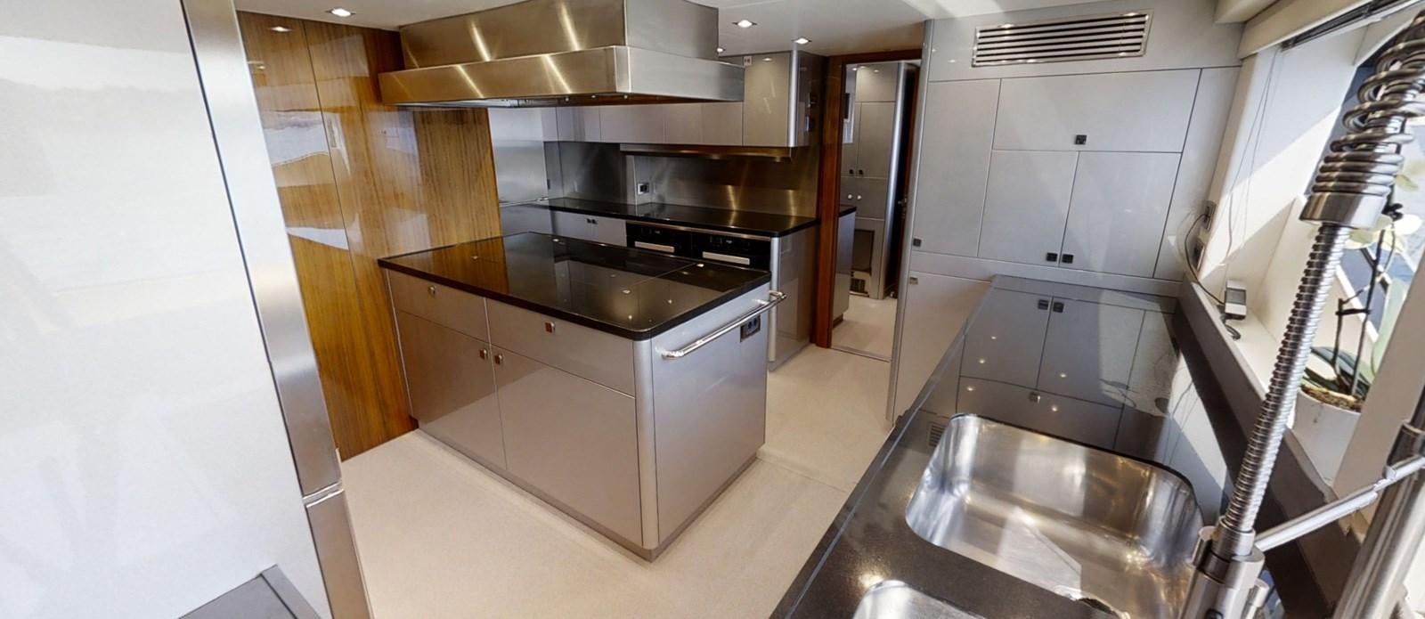a kitchen with stainless steel appliances aboard ALADDIN Yacht for Sale