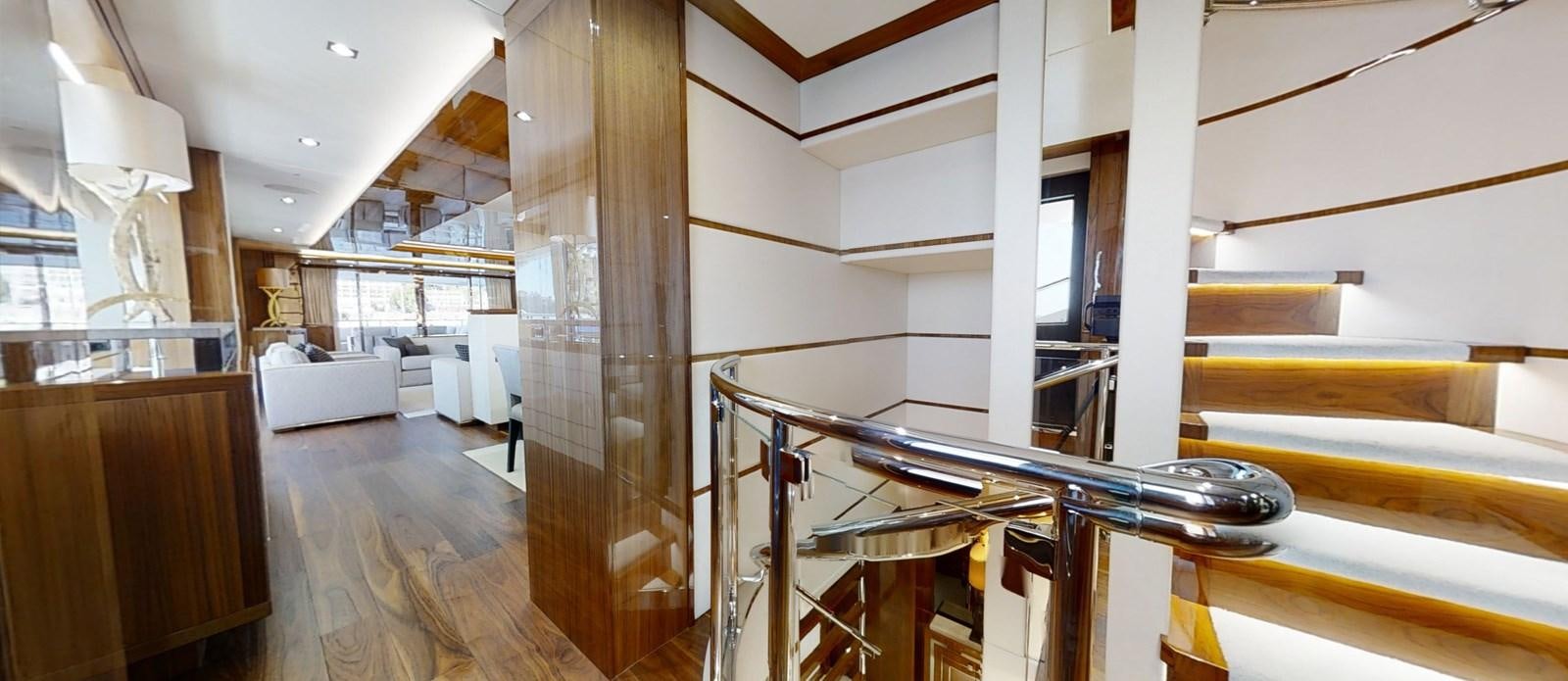 a room with wooden floors and white walls aboard ALADDIN Yacht for Sale