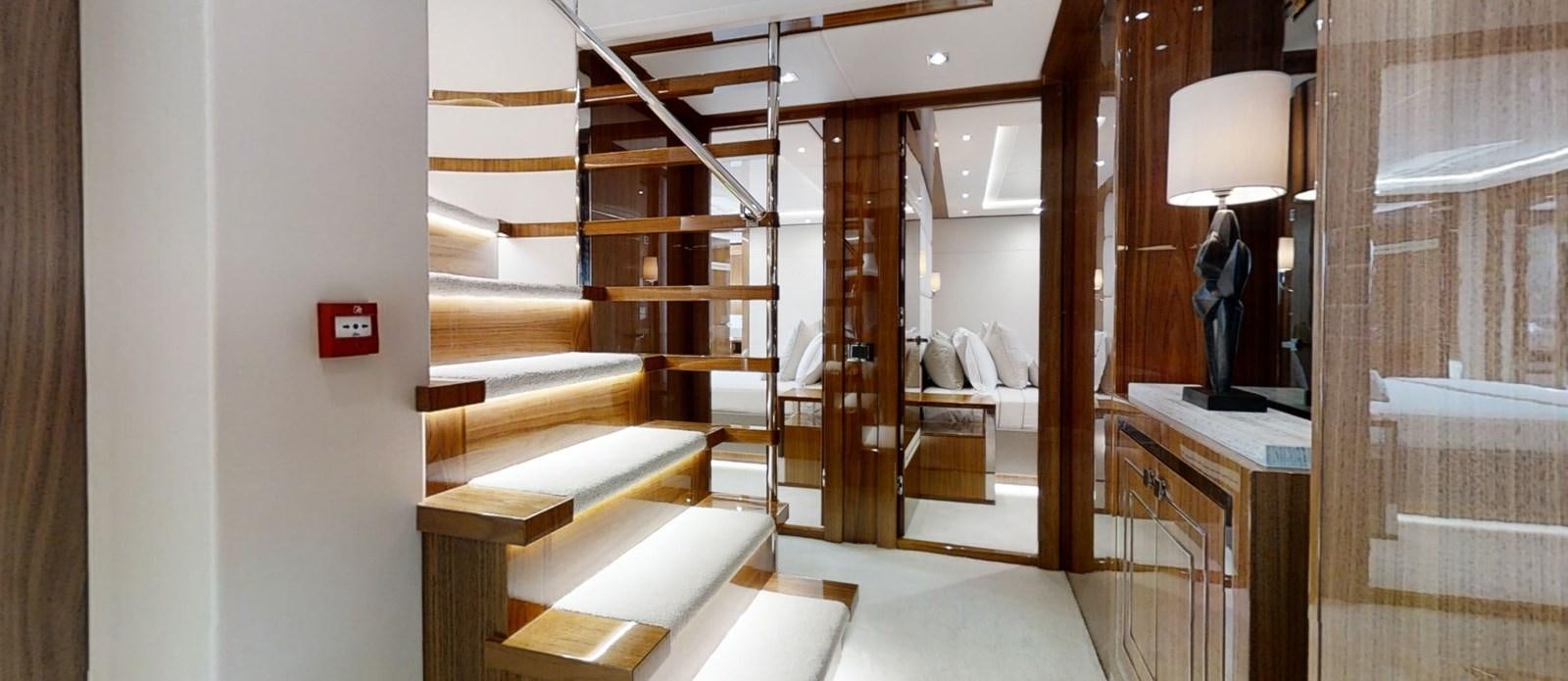 a room with a bed and a lamp aboard ALADDIN Yacht for Sale