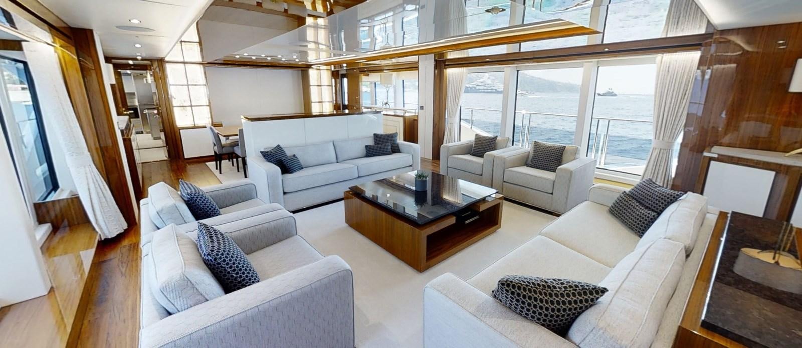 a living room with a couch and a coffee table aboard ALADDIN Yacht for Sale