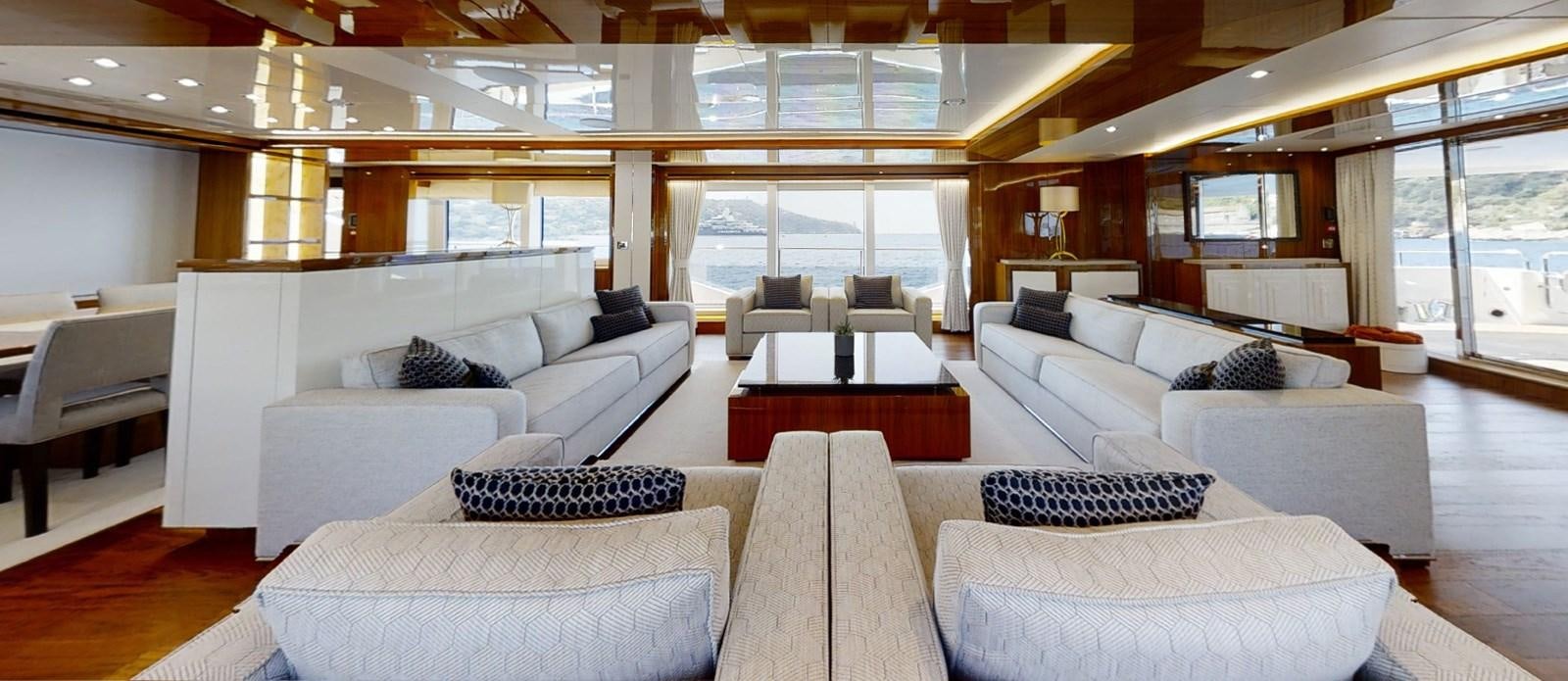 a large living room with a large window aboard ALADDIN Yacht for Sale