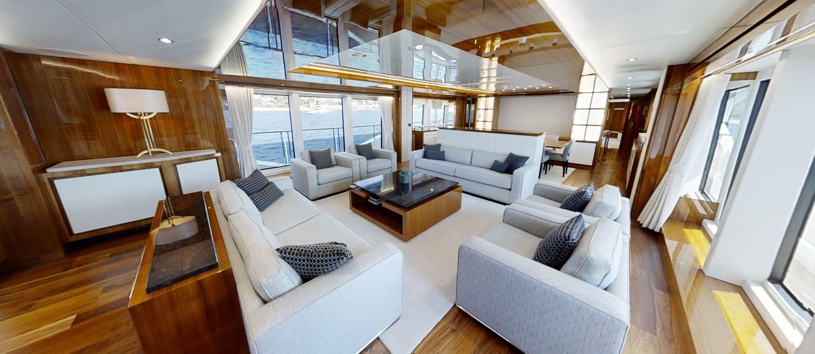 a living room with a couch and a table aboard ALADDIN Yacht for Sale