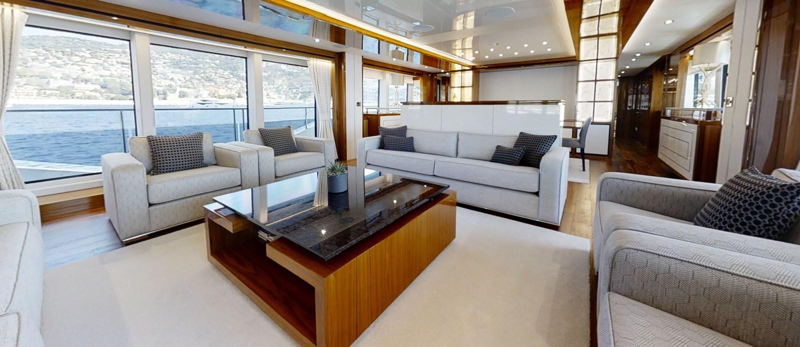 a living room with a couch and a coffee table aboard ALADDIN Yacht for Sale