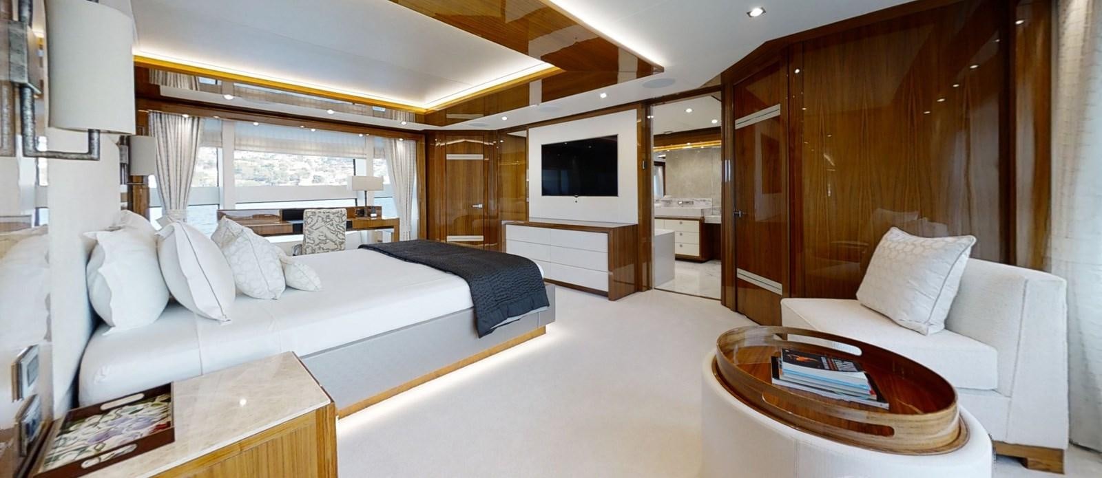 a room with a bed and a television aboard ALADDIN Yacht for Sale