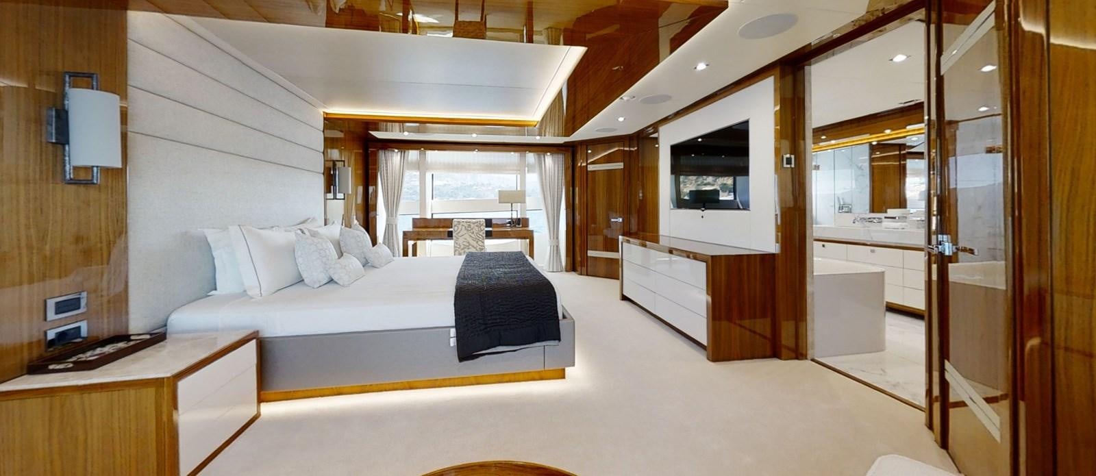 a room with a bed and a tv aboard ALADDIN Yacht for Sale