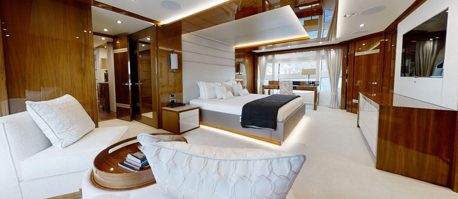 a room with a bed and a table aboard ALADDIN Yacht for Sale