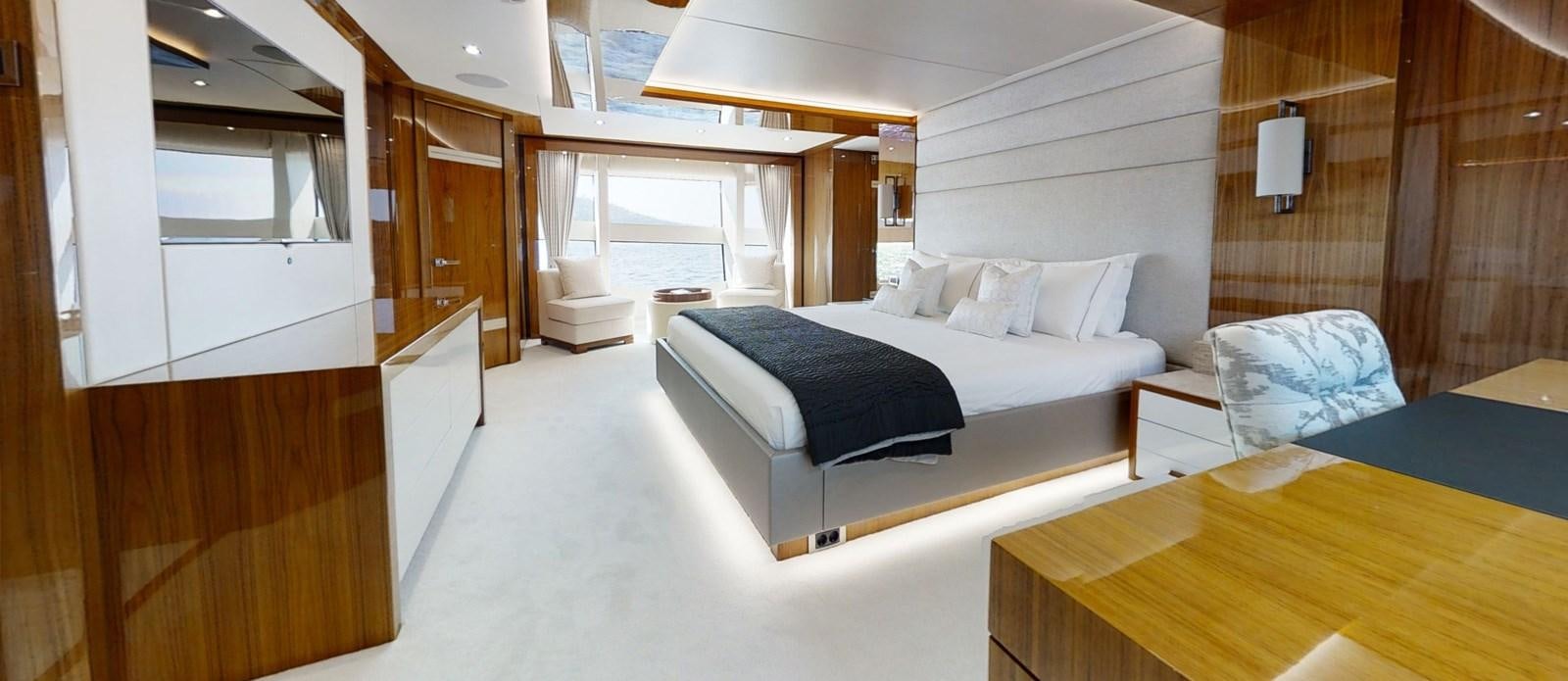a room with a bed and a table aboard ALADDIN Yacht for Sale