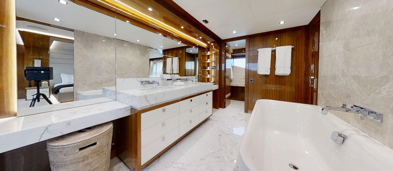 a bathroom with a large mirror aboard ALADDIN Yacht for Sale
