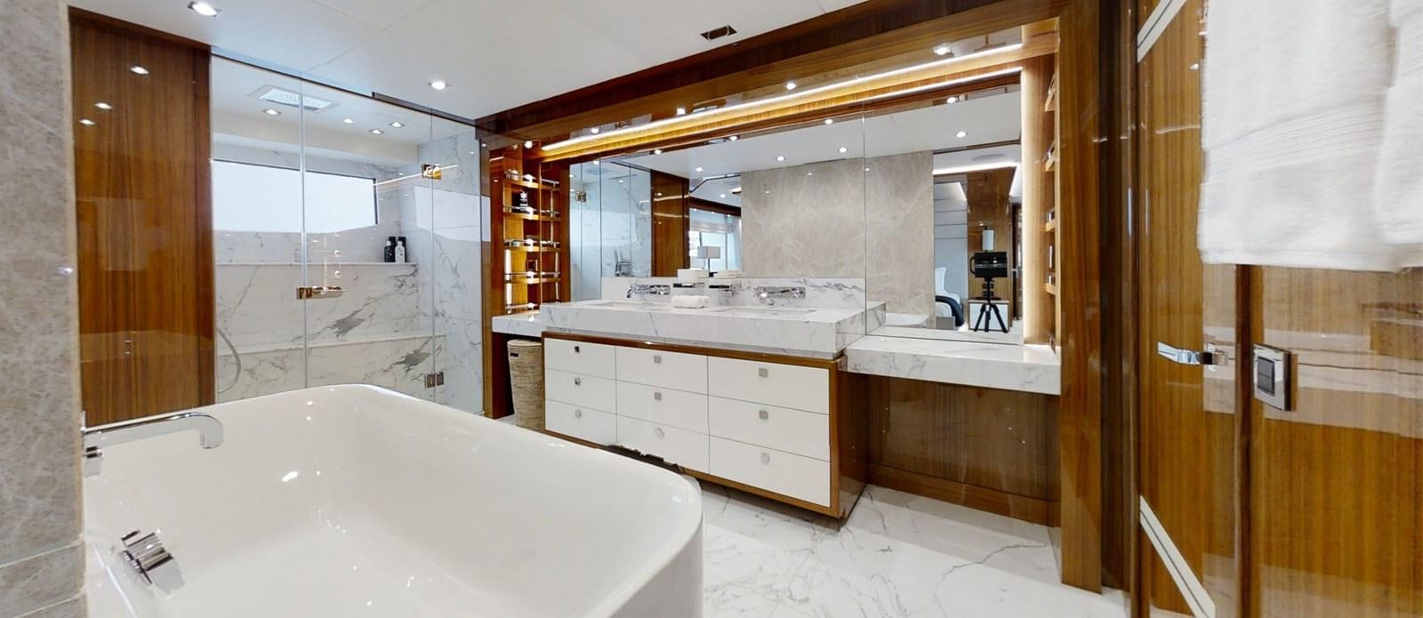 a bathroom with a large mirror aboard ALADDIN Yacht for Sale