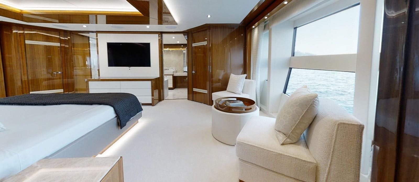 a room with a bed and a television aboard ALADDIN Yacht for Sale