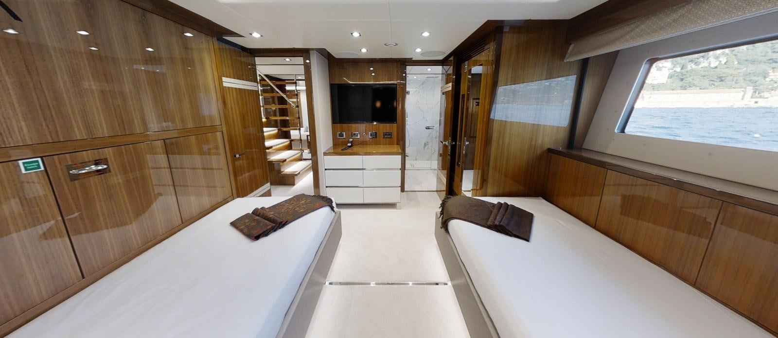 a room with a bed and a desk aboard ALADDIN Yacht for Sale