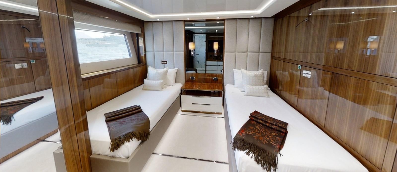 a room with a bed and a window aboard ALADDIN Yacht for Sale