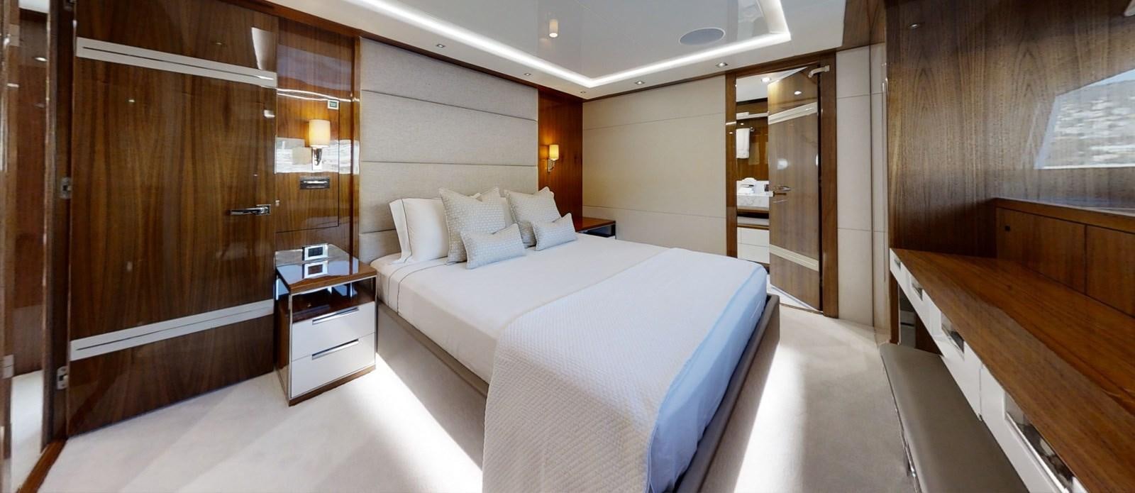 a room with a bed and a closet aboard ALADDIN Yacht for Sale