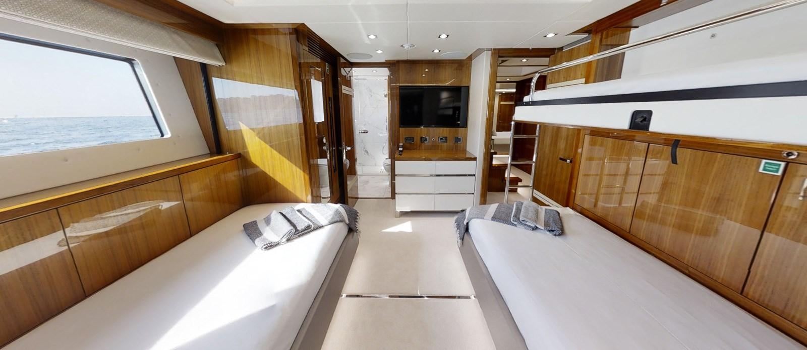 a room with a bed and a tv aboard ALADDIN Yacht for Sale