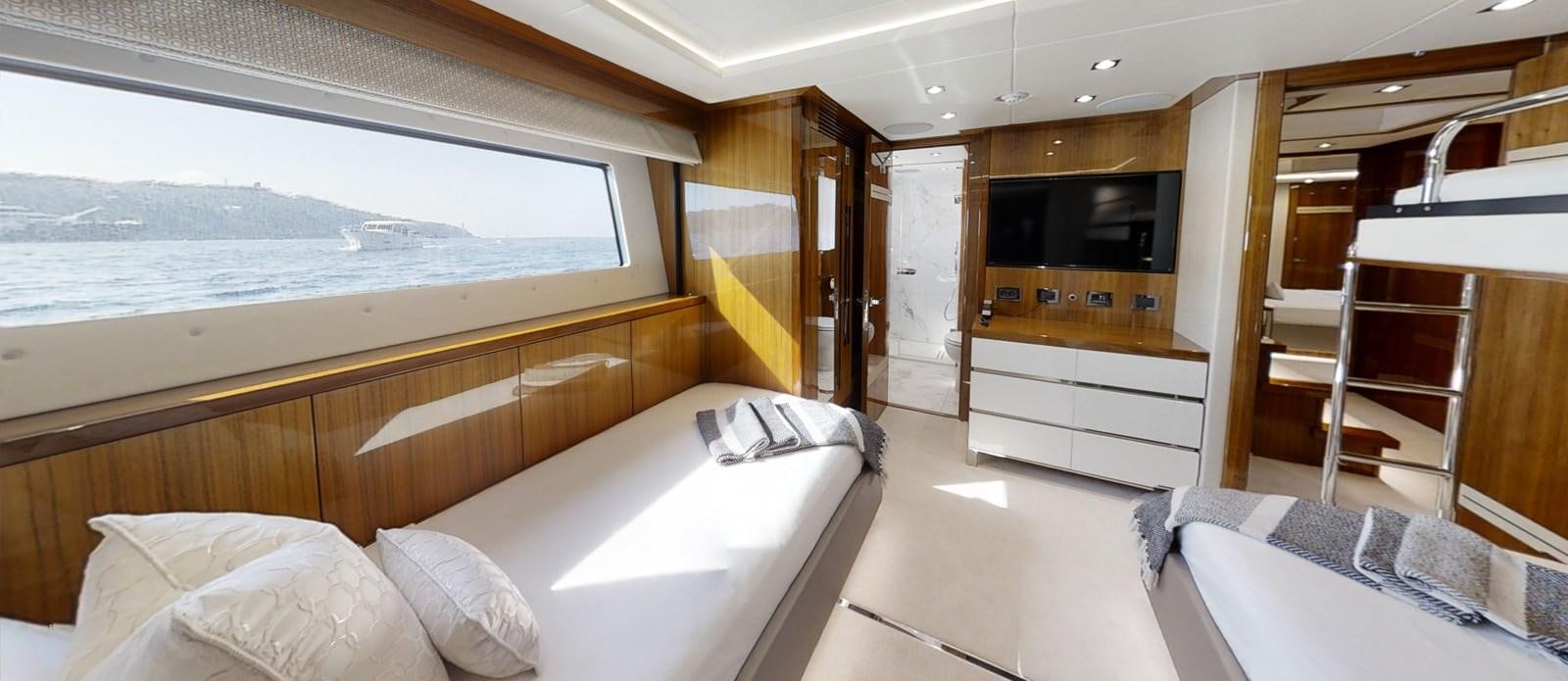 a room with a bed and a television aboard ALADDIN Yacht for Sale