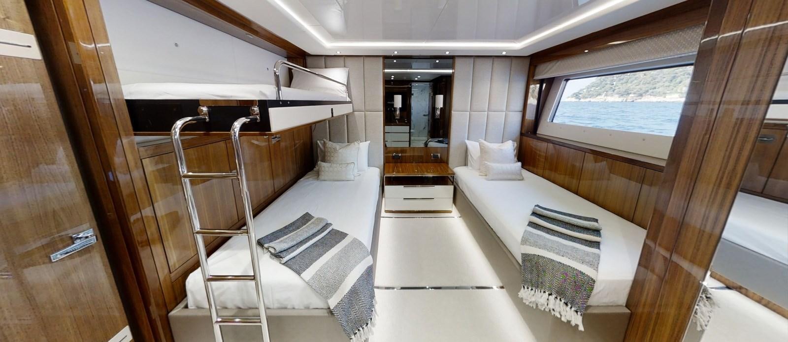 a room with a bed and a window aboard ALADDIN Yacht for Sale