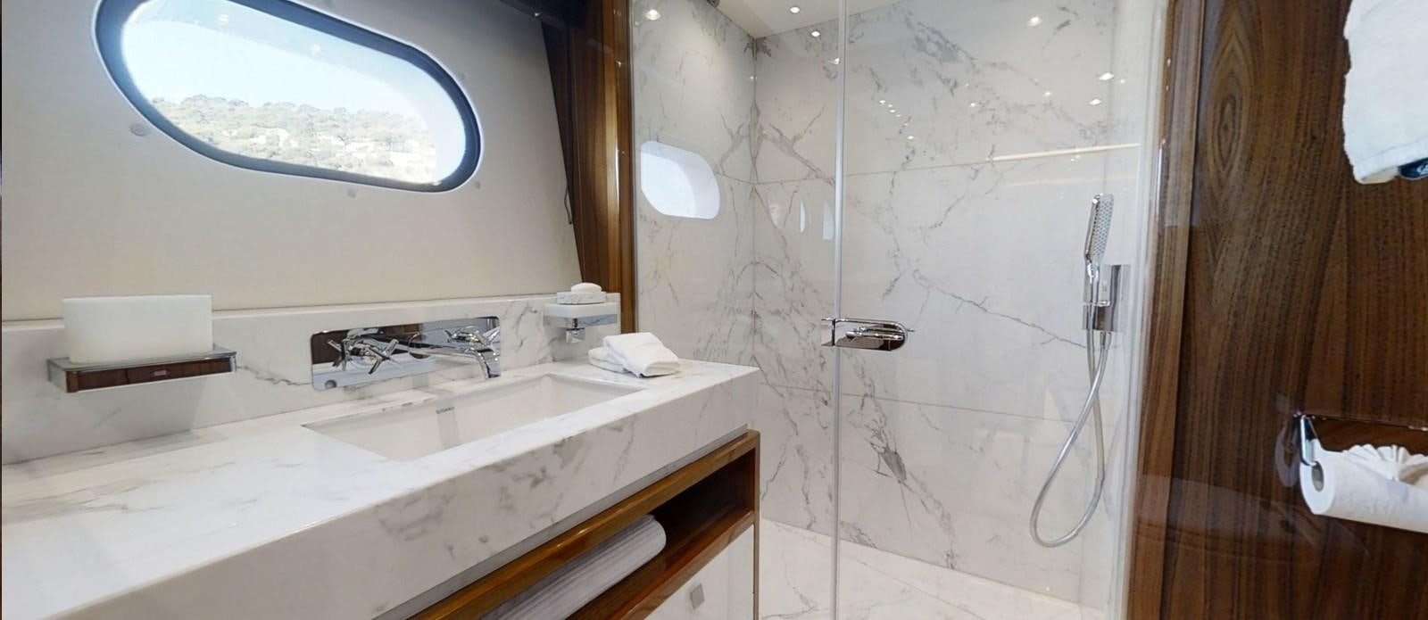 a bathroom with a sink and a mirror aboard ALADDIN Yacht for Sale