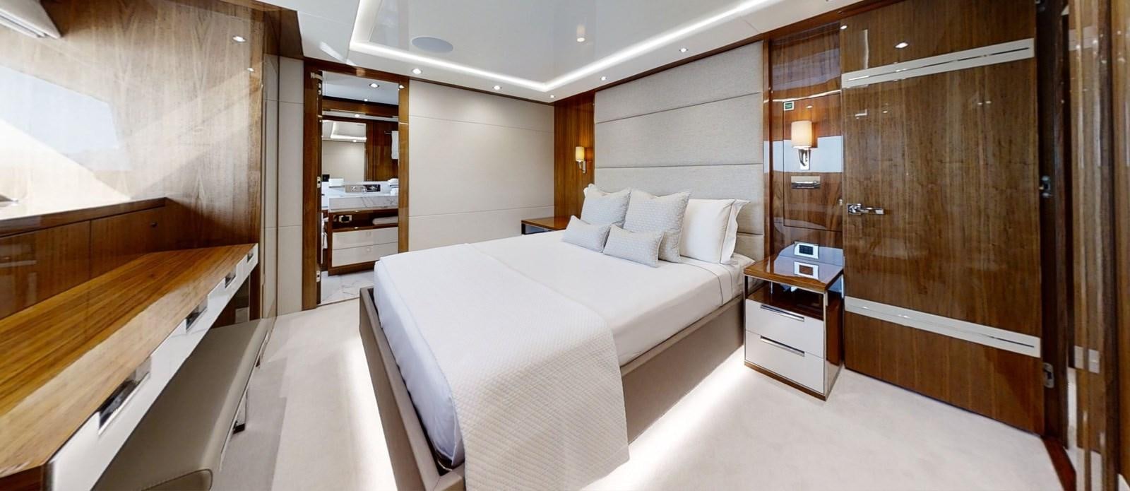 a room with a bed and a desk aboard ALADDIN Yacht for Sale