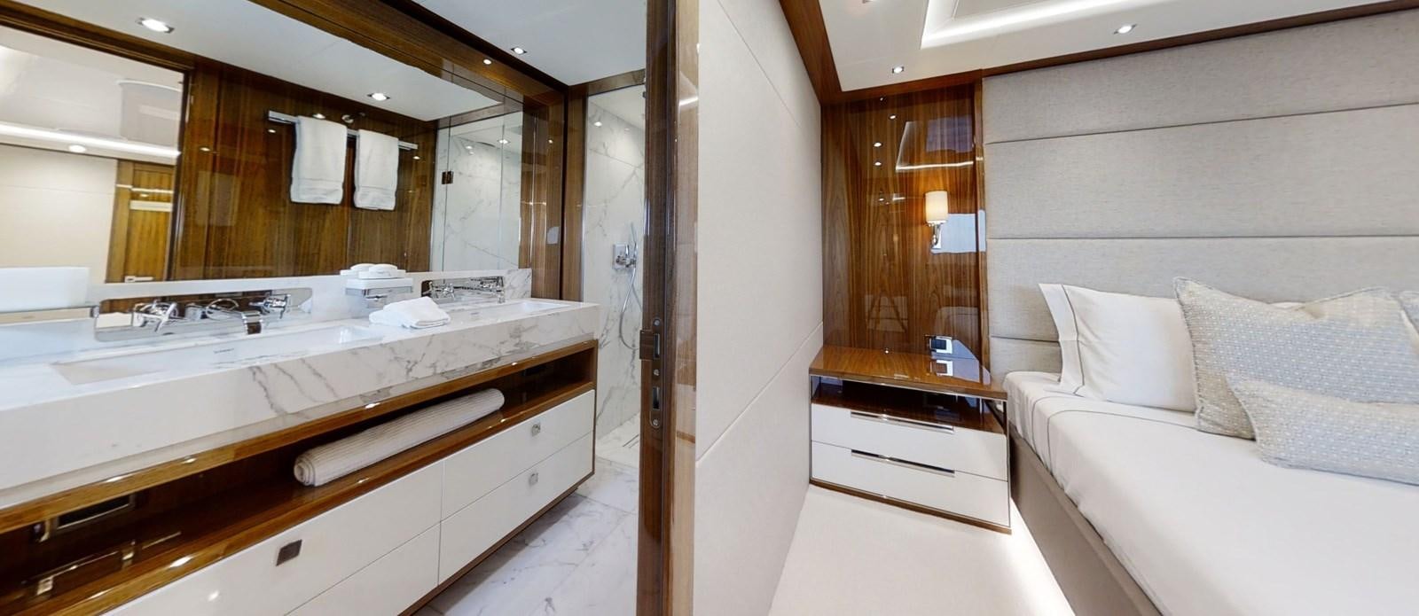 a room with a bed and a mirror aboard ALADDIN Yacht for Sale