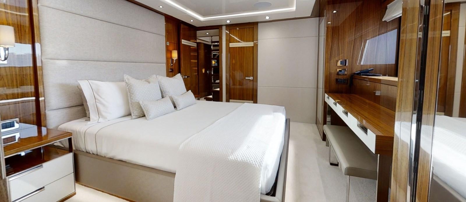 a room with a bed and a desk aboard ALADDIN Yacht for Sale