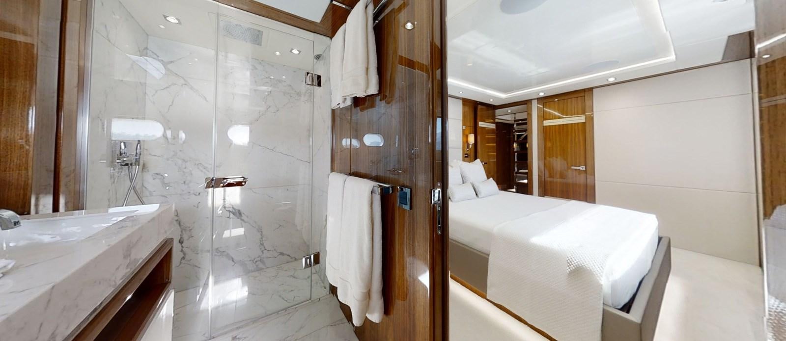 a bathroom with a glass shower aboard ALADDIN Yacht for Sale