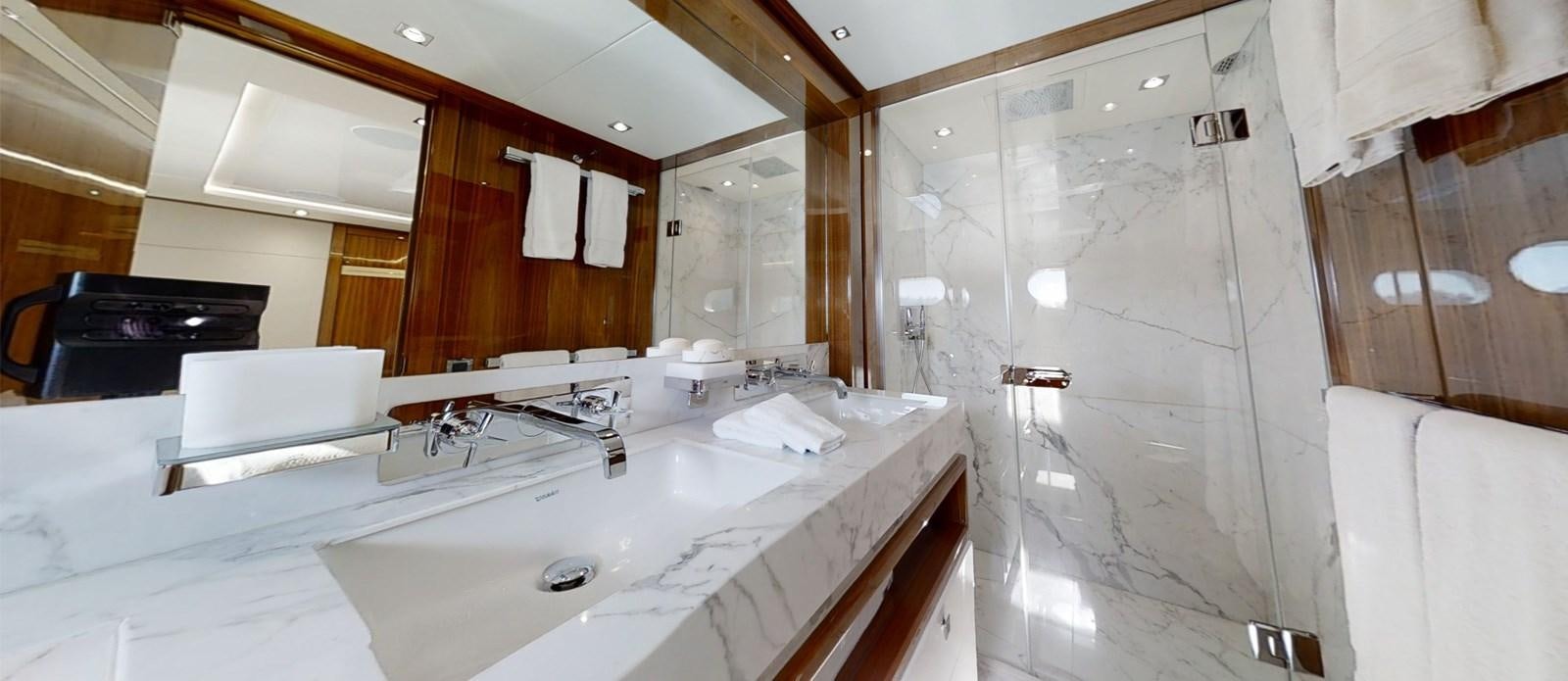 a bathroom with a bathtub sink and a mirror aboard ALADDIN Yacht for Sale