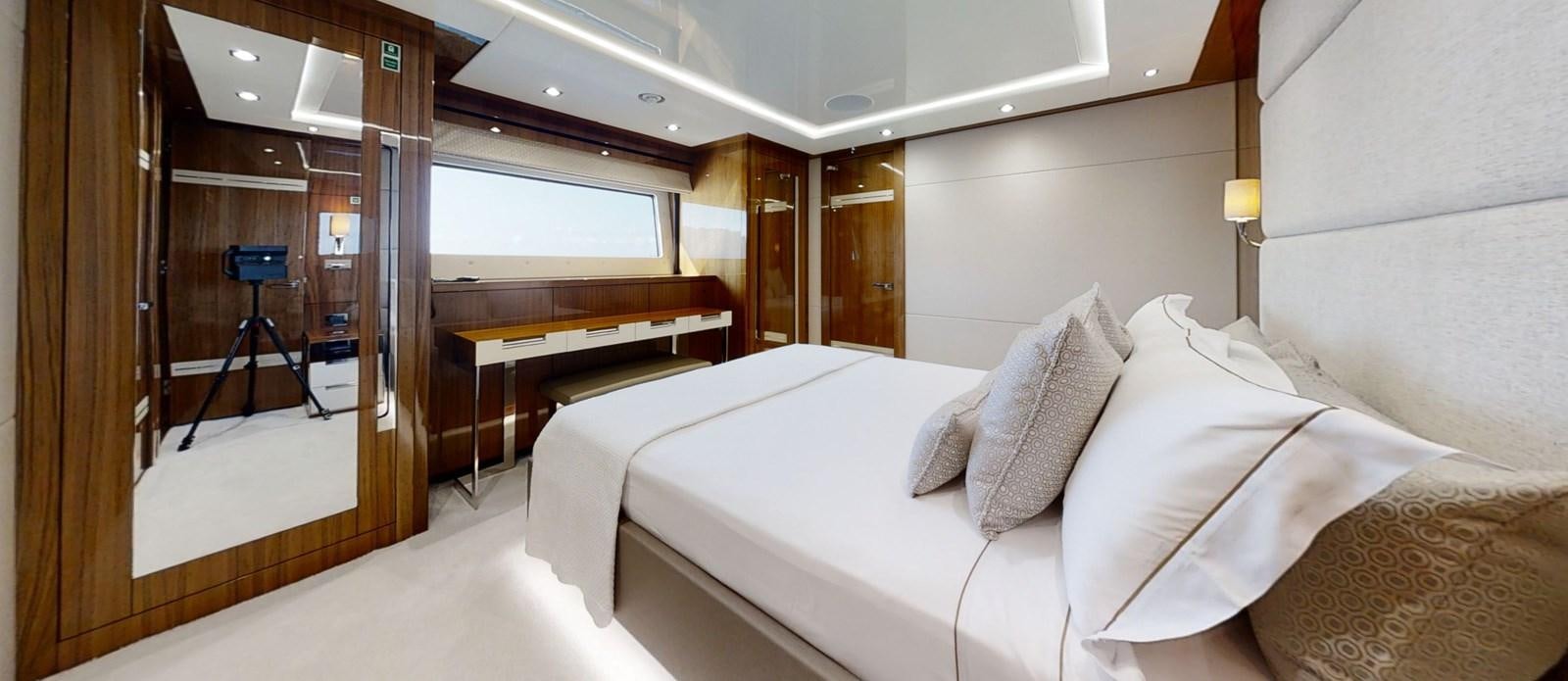 a room with a bed and a desk aboard ALADDIN Yacht for Sale
