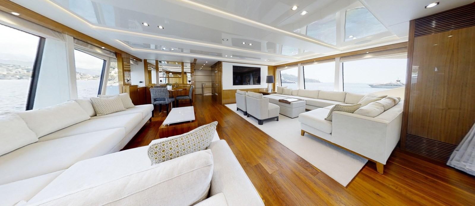 a room with a couch and a television aboard ALADDIN Yacht for Sale
