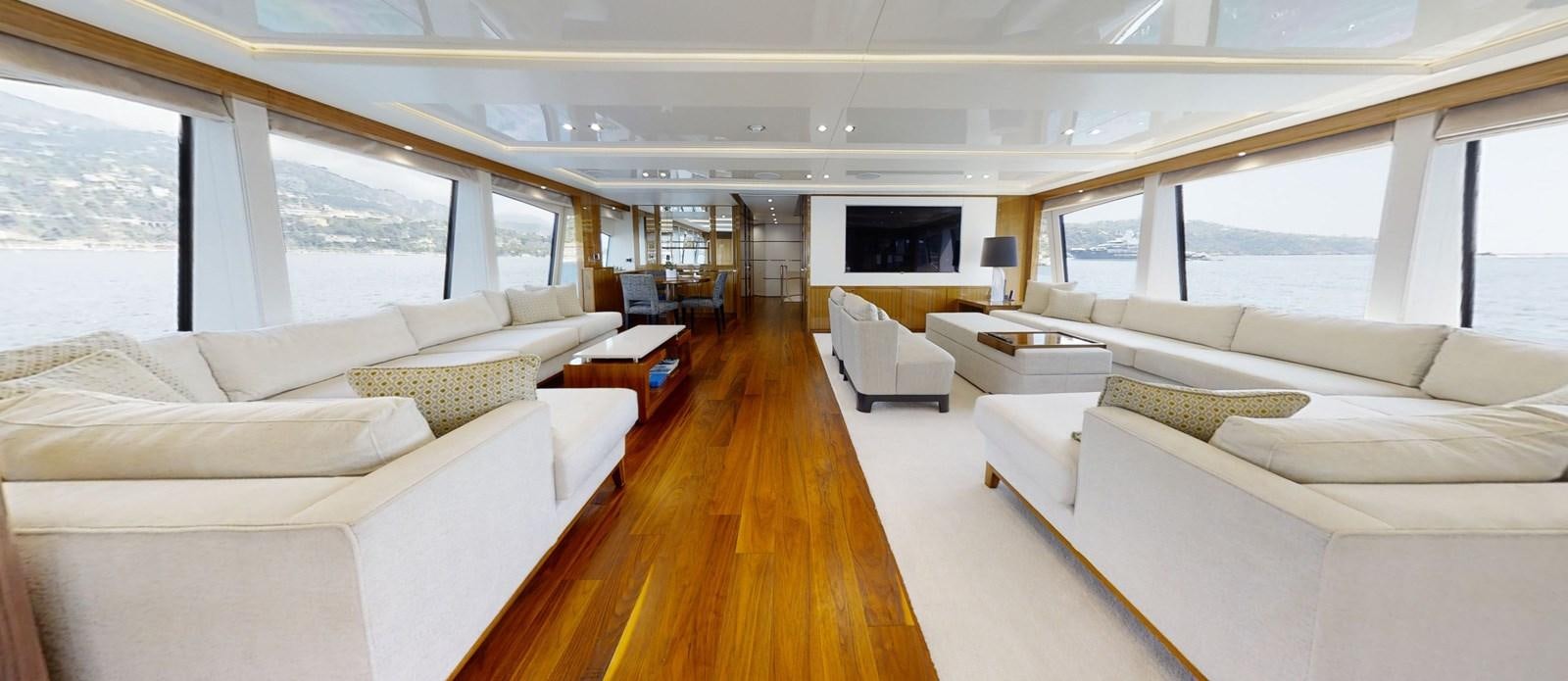 a large living room with a large window aboard ALADDIN Yacht for Sale