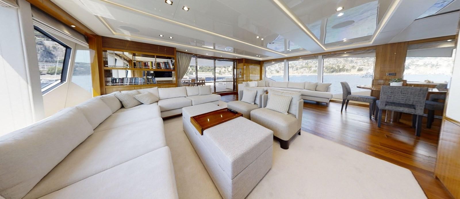 a living room with a large window aboard ALADDIN Yacht for Sale