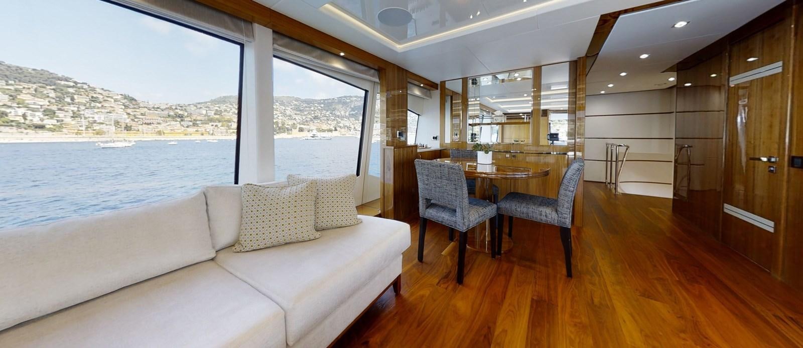a living room with a couch and a table aboard ALADDIN Yacht for Sale