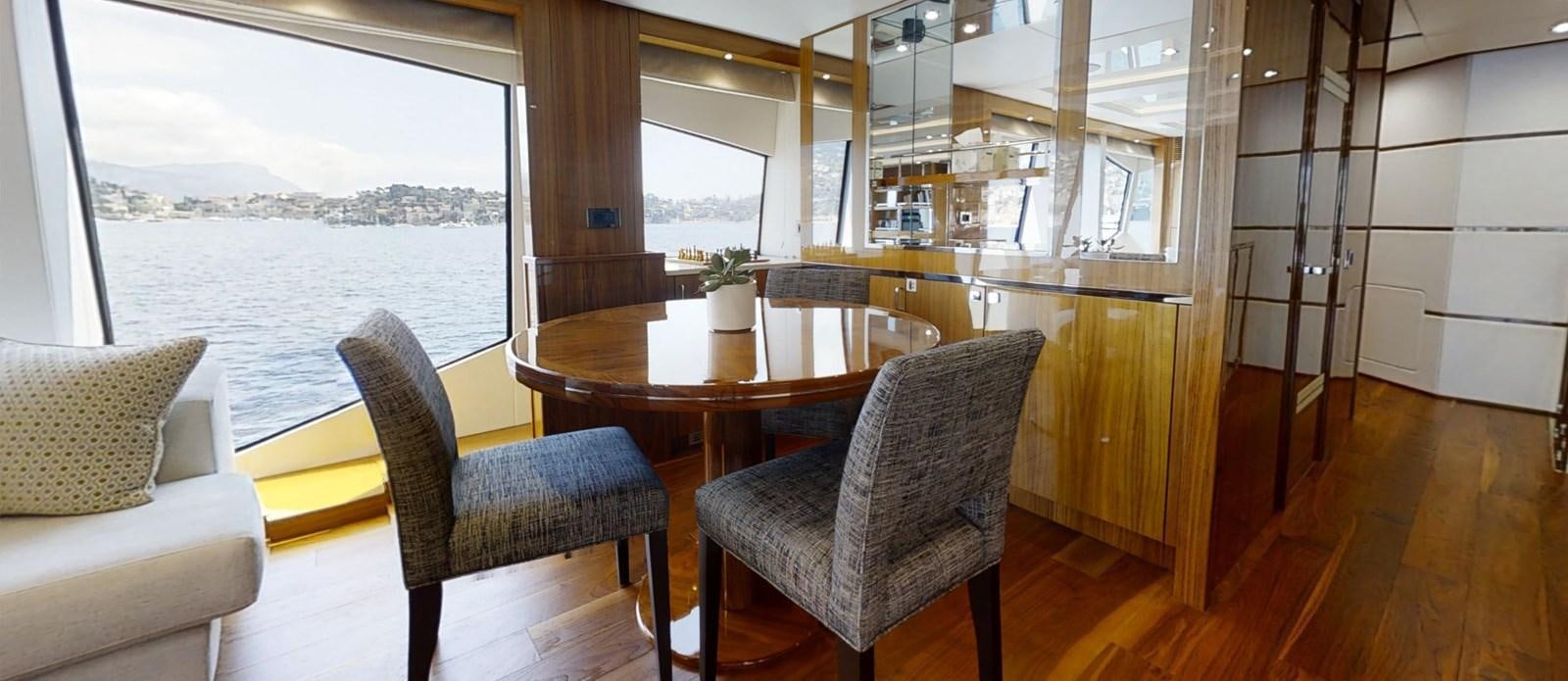 a room with a table and chairs aboard ALADDIN Yacht for Sale