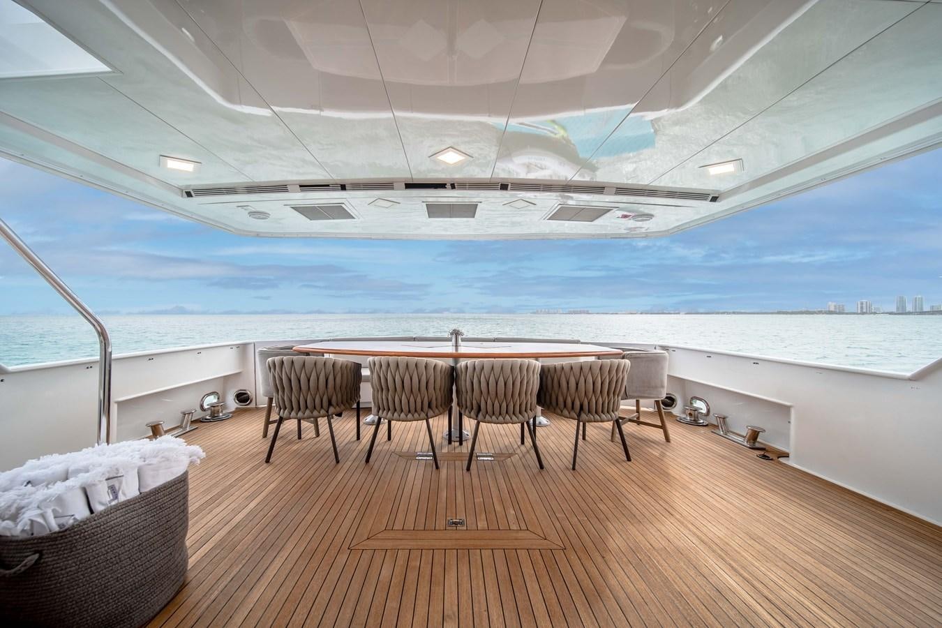 a room with a table and chairs aboard OCEAN DRIVE Yacht for Sale