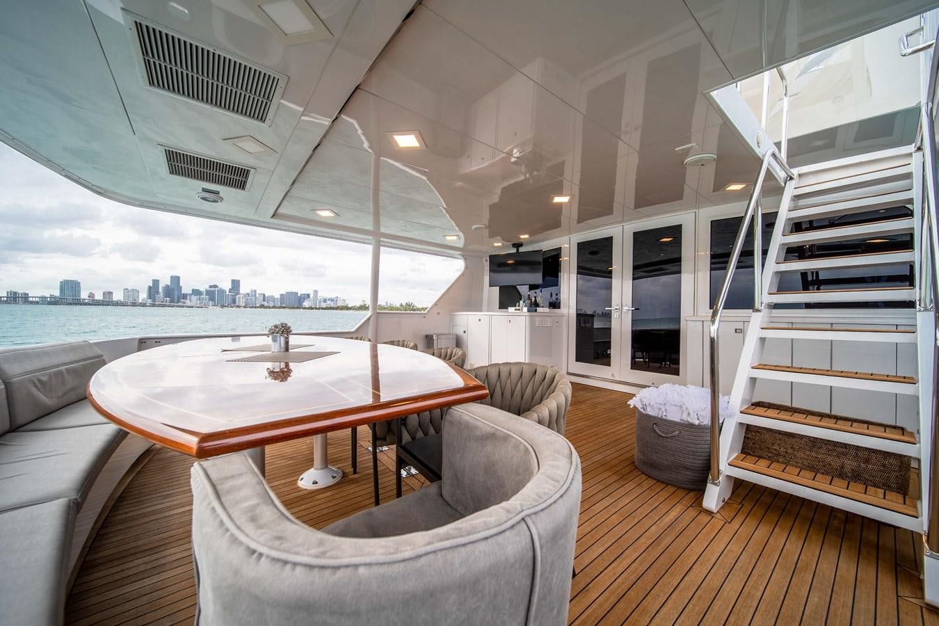 a room with a table and chairs aboard OCEAN DRIVE Yacht for Sale