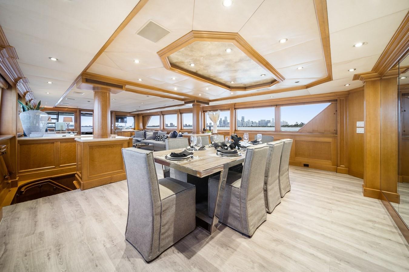 a large room with a table and chairs aboard OCEAN DRIVE Yacht for Sale