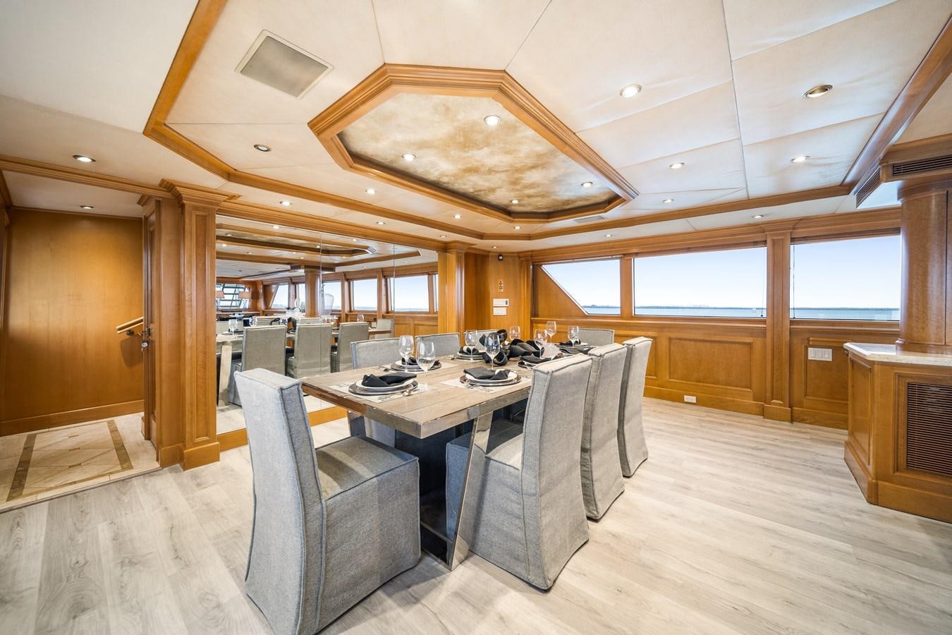 a large kitchen with a table and chairs aboard OCEAN DRIVE Yacht for Sale
